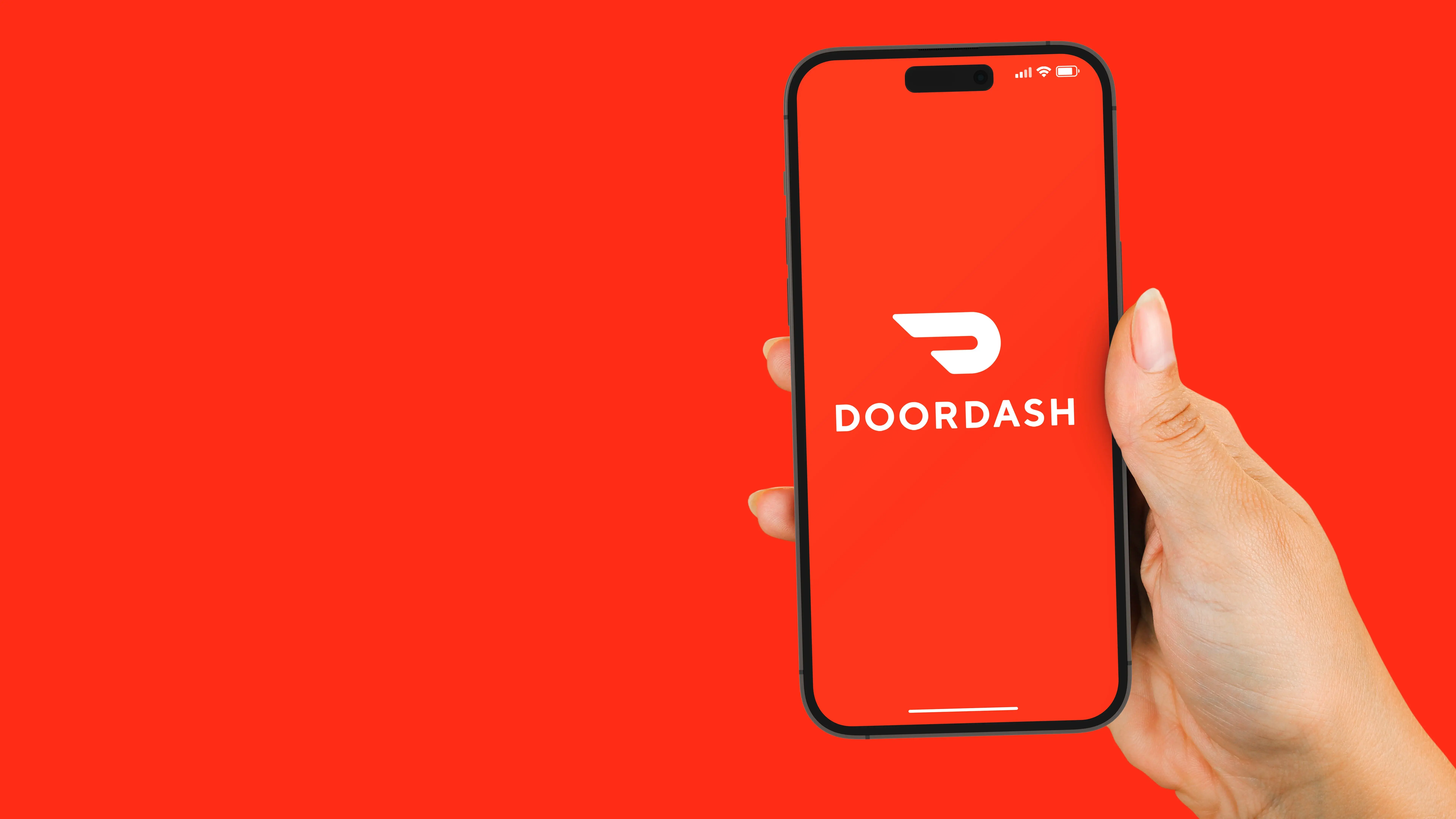 DoorDash clone app — hand holding a phone with the DoorDash app open